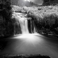 Buy canvas prints of Enchanting Glenglave Waterfall by Les McLuckie