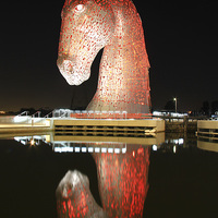 Buy canvas prints of Glowing Red Kelpies A Majestic Sight by Les McLuckie