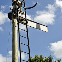 Buy canvas prints of Old type semaphore signal set against a blue sky by Frank Irwin