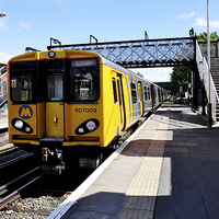 Buy canvas prints of A Merseyrail train, above ground by Frank Irwin