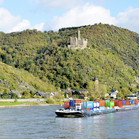 Buy canvas prints of A Rhine boat sails past Burg Maus by Frank Irwin