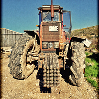 Buy canvas prints of A powerful “SAME” tractor on a farm by Frank Irwin
