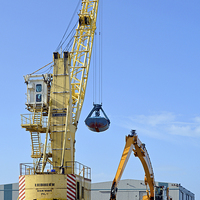 Buy canvas prints of Dockside cranes with clamshell buckets by Frank Irwin