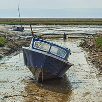 Buy canvas prints of A small motorboat beached in Heswall. by Frank Irwin