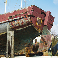 Buy canvas prints of The stern of a boat at Heswall Beach by Frank Irwin