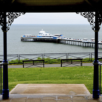 Buy canvas prints of Picture of Llandudno Pier through the bandstand by Frank Irwin