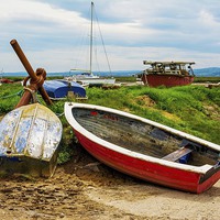 Buy canvas prints of A row of small boats beached awaiting the incoming by Frank Irwin
