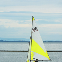 Buy canvas prints of A lone yacht West Kirby's Marine Lake by Frank Irwin