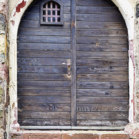 Buy canvas prints of  A Tatty German timber door by Frank Irwin