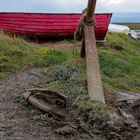 Buy canvas prints of  A Colourful red boat lies on Heswall Beach by Frank Irwin