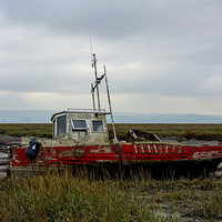 Buy canvas prints of  An abandoned and worse for wear boat by Frank Irwin