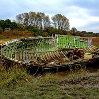 Buy canvas prints of  An abandoned and worse for wear boat by Frank Irwin