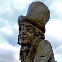 Buy canvas prints of Llandudno's Tree carving of The Mad Hatter by Frank Irwin