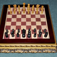 Buy canvas prints of Eearly 1900s chess set on a medieval style board by Frank Irwin