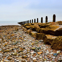 Buy canvas prints of  An Ocean  groyne on the North Wales by Frank Irwin
