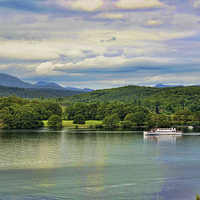 Buy canvas prints of  A cruise boat sails along on Windermere by Frank Irwin