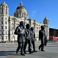 Buy canvas prints of Statue of the Beatles at Liverpool's Pier Head. by Frank Irwin