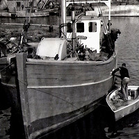 Buy canvas prints of A fishing boat - running maintenance by Frank Irwin