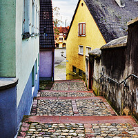 Buy canvas prints of A quiet rising path between properties in Breisach by Frank Irwin