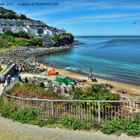 Buy canvas prints of Enjoying time in the sunshine on New Quay beach by Frank Irwin