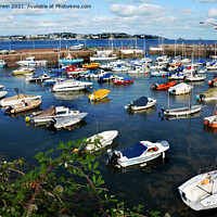 Buy canvas prints of Small boats lie at anchor in Paignton Harbour by Frank Irwin