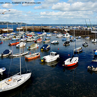 Buy canvas prints of Small boats lie at anchor waiting for the weekend  by Frank Irwin
