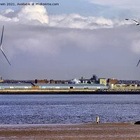 Buy canvas prints of A lone fisherman dwarfed by two "on-shore wind tur by Frank Irwin