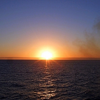 Buy canvas prints of Sunset , Sea and Smoke by Bill Lighterness