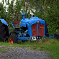 Buy canvas prints of  The Blue Tractor by Bill Lighterness
