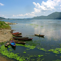 Buy canvas prints of Fishing Boats in Nepal by Sophia Yarwood