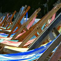 Buy canvas prints of Deckchairs on the beach at Beer in Devon by Peter McCormack