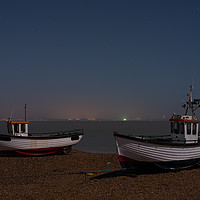 Buy canvas prints of Dungeness Fishing Boats At Night Under Moonlight by David Attenborough