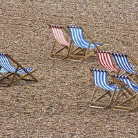 Buy canvas prints of Deckchairs on a Blustery Brighton Beach by Wendy Williams CPAGB