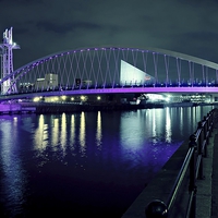 Buy canvas prints of The Lowry Bridge is violet by leonard alexander