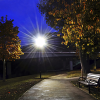 Buy canvas prints of The Twlight Lampost and the Bench by leonard alexander