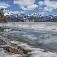 Buy canvas prints of Reflections in a Partially Thawed Lake Louise by Belinda Greb