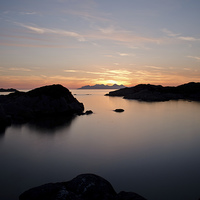 Buy canvas prints of Sunset over Eigg and Rhum by Dan Ward