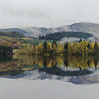 Buy canvas prints of Loch Ard autumn reflections panoramic by Dan Ward