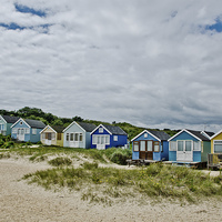 Buy canvas prints of Beach huts on Mudeford Spit by Dan Ward