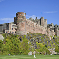 Buy canvas prints of Bamburgh Castle in the summertime by Dan Ward