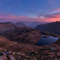 Buy canvas prints of Sunrise over Sprinkling Tarn, The Lake District by Dan Ward