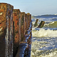 Buy canvas prints of Waves Against The Breakers by Tom and Dawn Gari