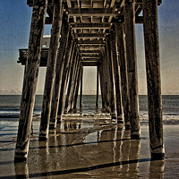 Buy canvas prints of Under The Pier by Tom and Dawn Gari