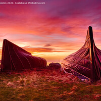 Buy canvas prints of Boat huts and Lindisfarne Castle at sunrise by David Preston