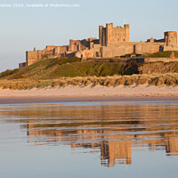 Buy canvas prints of Bamburgh Castle in the evening light by David Preston