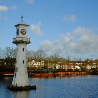 Buy canvas prints of Roath Park Lighthouse and Boathouse by Richard Parry