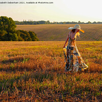 Buy canvas prints of Young woman in a straw hat in Autumn by Elizabeth Debenham