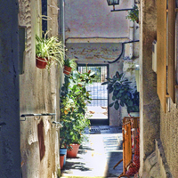 Buy canvas prints of An alleyway in Lanjaron by Adrian Wilkinson