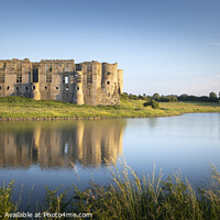 Buy canvas prints of Carew Castle reflected by the evening sun  by Chris Warren