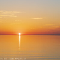 Buy canvas prints of Sun setting over a calm sea by Chris Warren